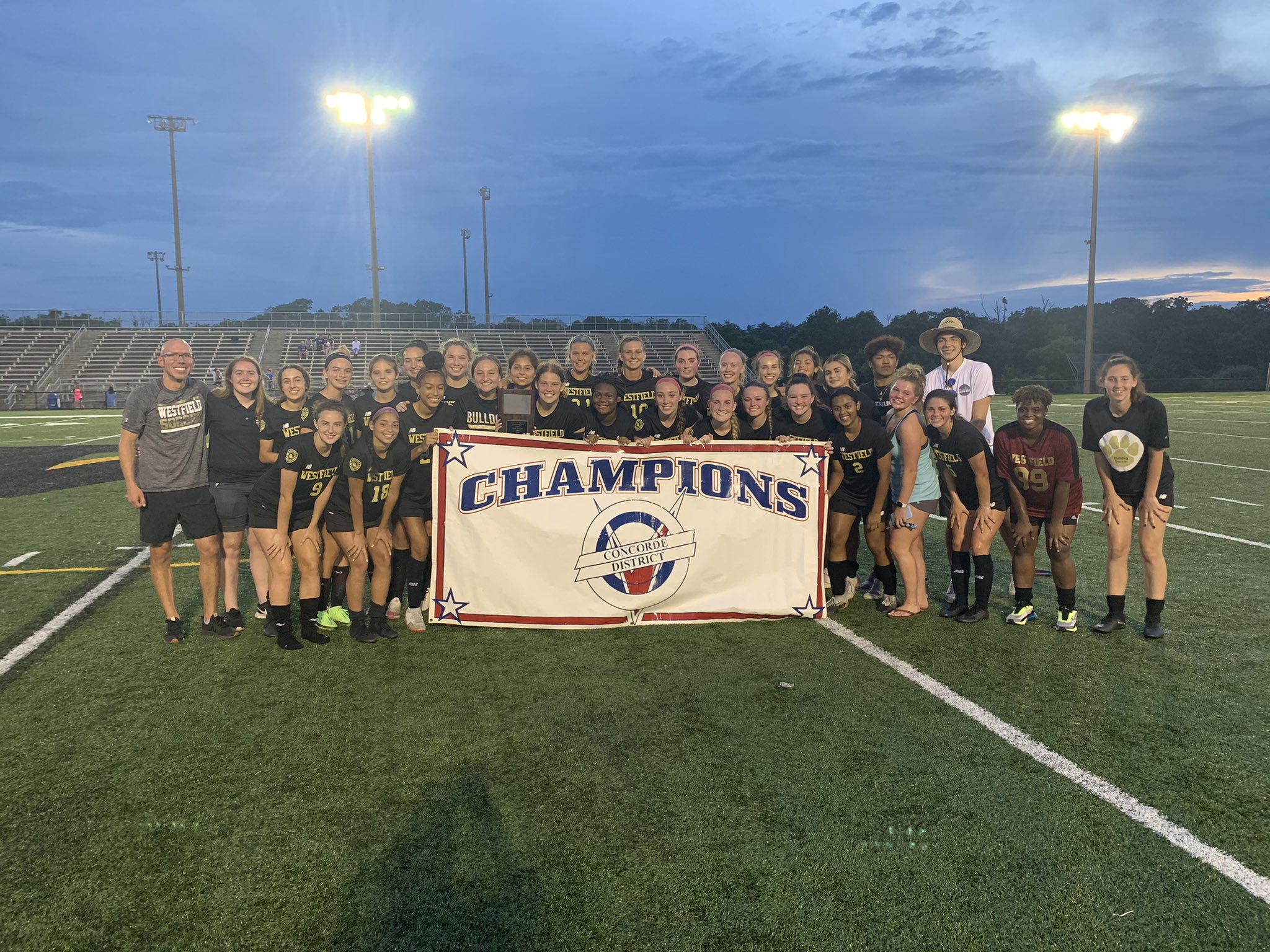 soccer team with district banner