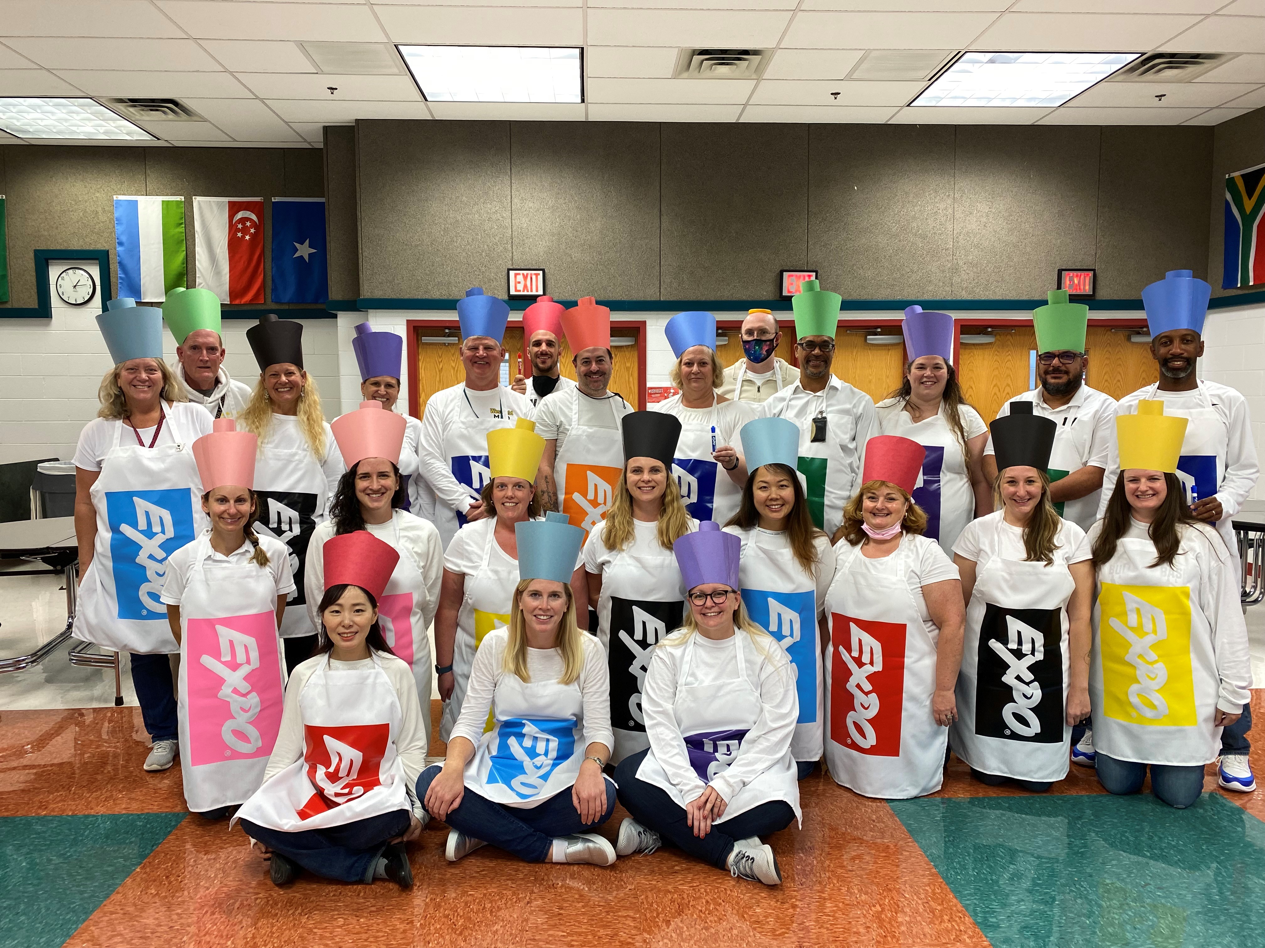 Members of the math department pose in their group Halloween costume. They are dressed as expo markers.
