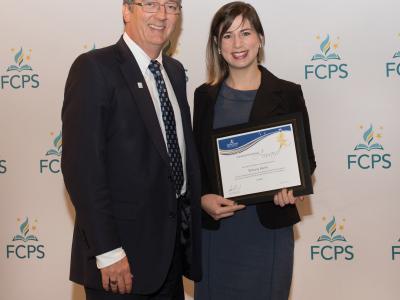 Photo of Brittany Burke receiving award